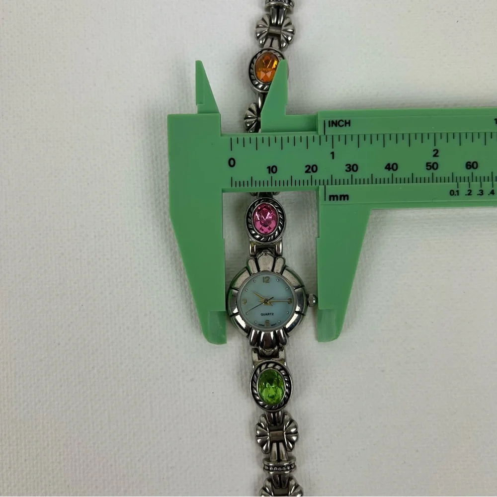 Elegant Silver Tone Quartz watch with Pink, Green, Gold and Blue Accents